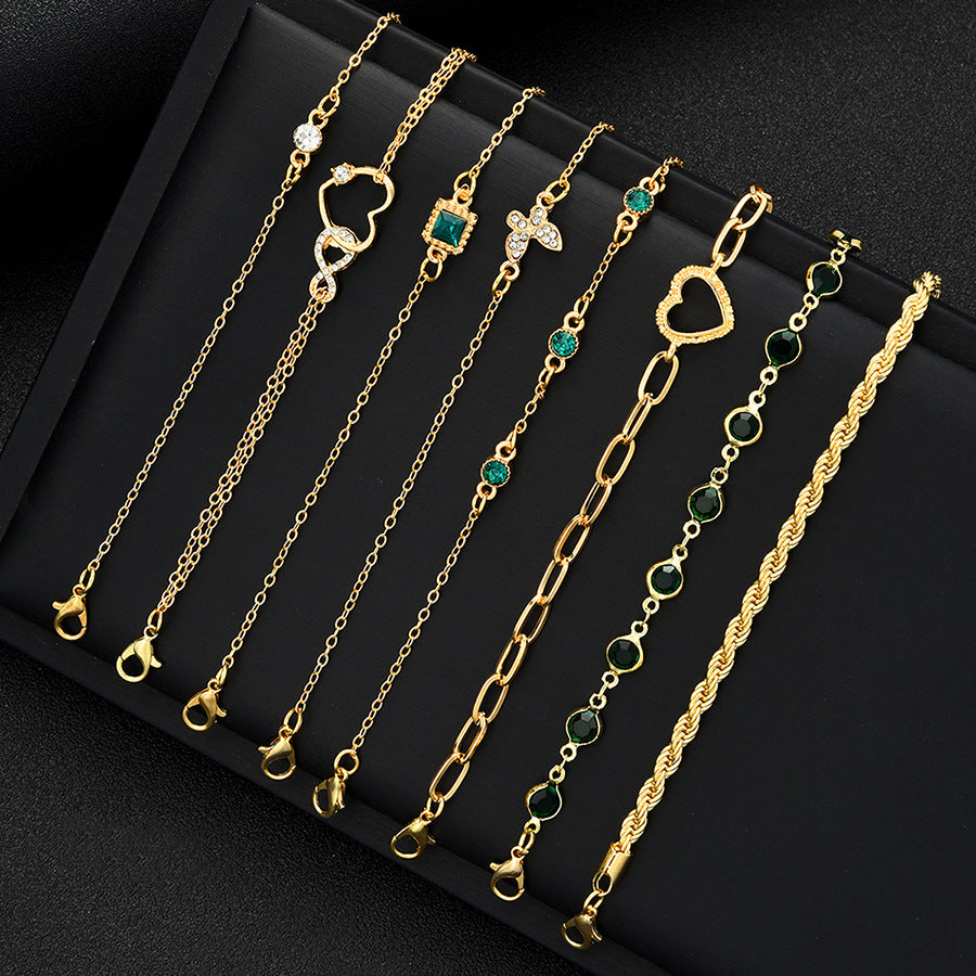 Damen Armband-Set mit funkelnden und eleganten goldenen Verzierungen Shop Nory