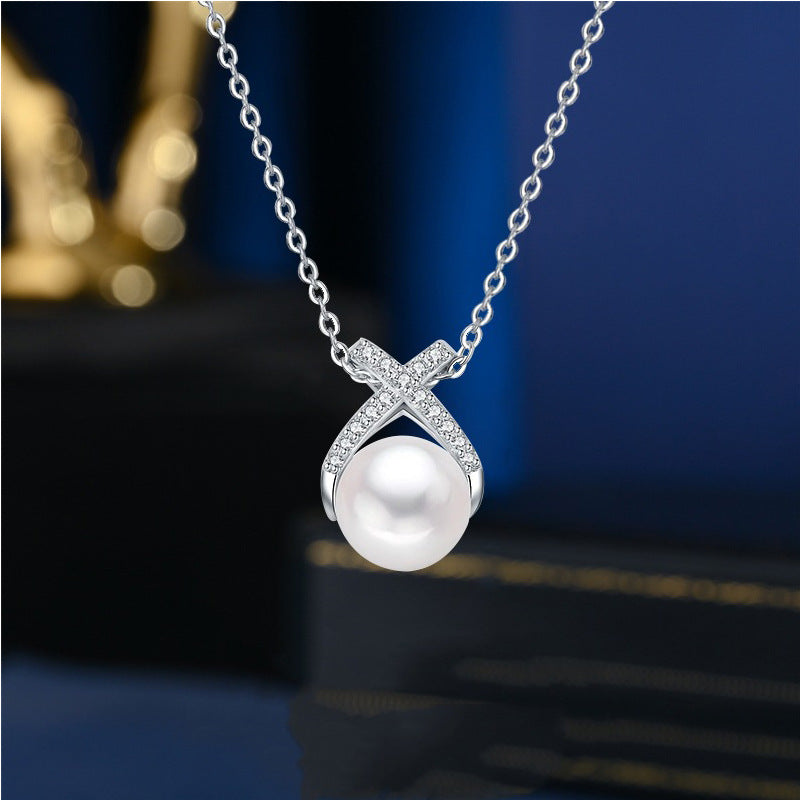 Damen Halskette mit funkelndem Perlenanhänger und eleganter Zirkonia-Fassung Shop Nory