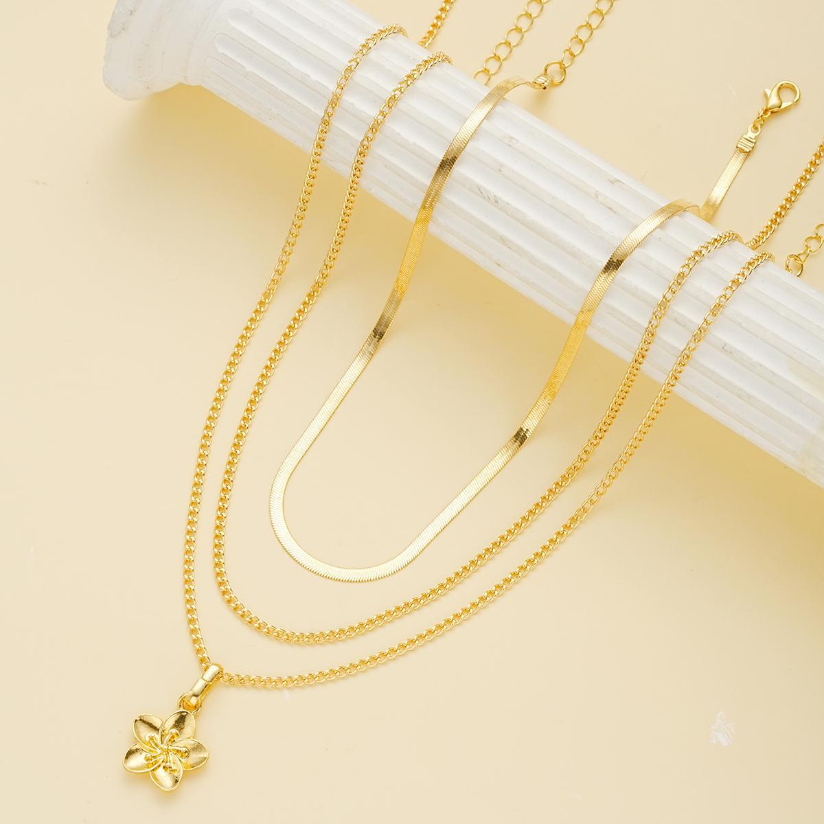 Damen Halsketten-Set mit feinen Goldketten und filigranem Blumenanhänger Shop Nory