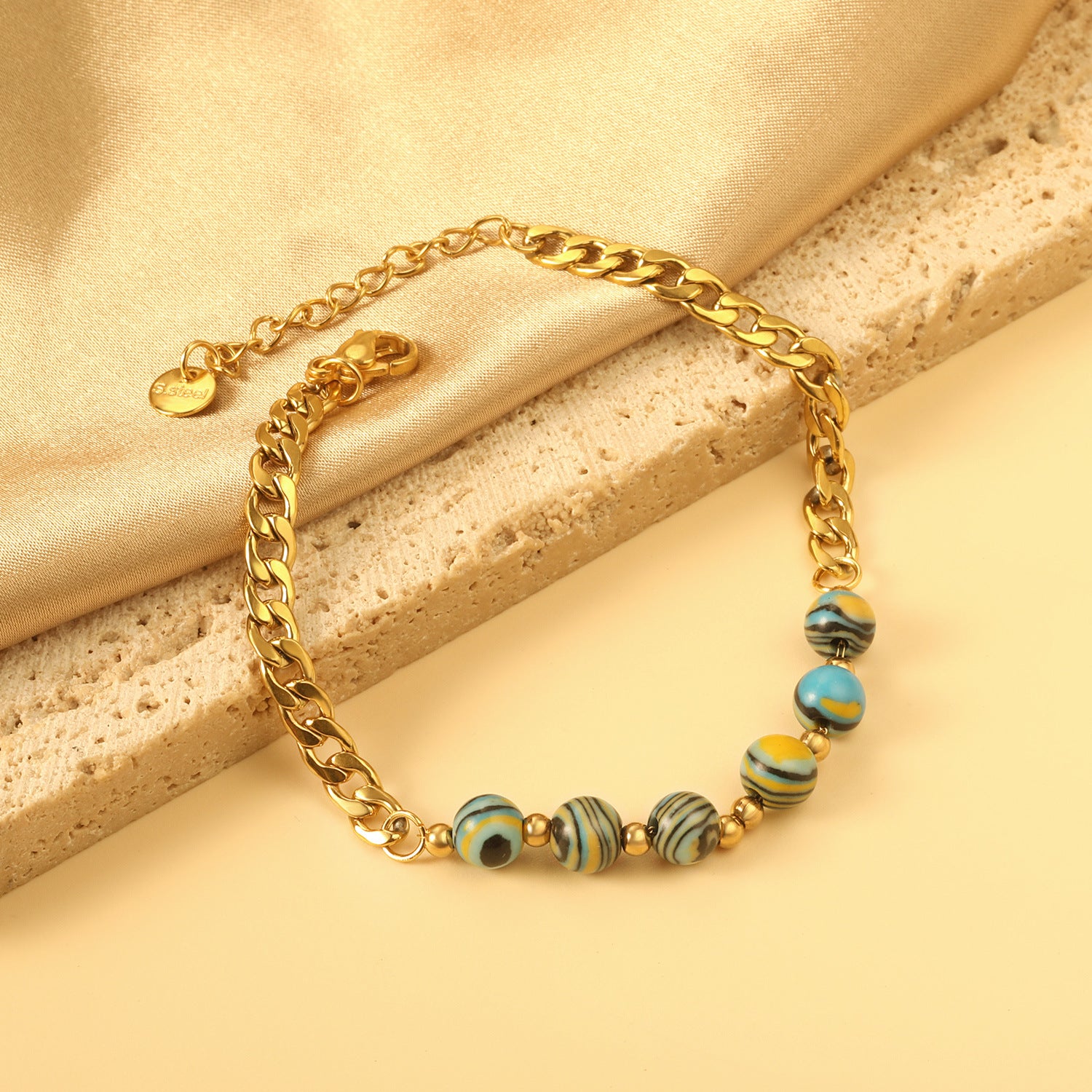 Damen Armband mit glänzender Gliederkette und elegantem Zebra-Muster Shop Nory