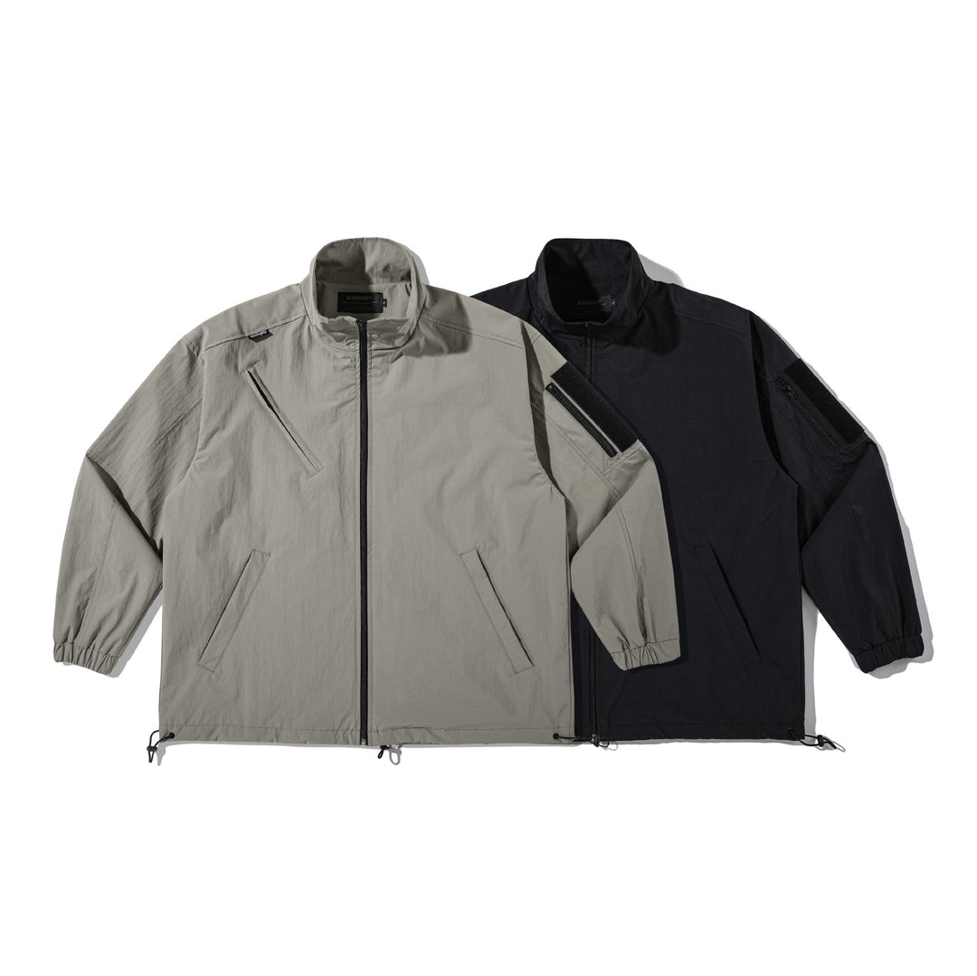 Unisex Leichtgewichtiger technischer Windparka mit Tunnelzug, Reißverschlusstaschen und Ärmel‑Utilitytasche Shop Nory