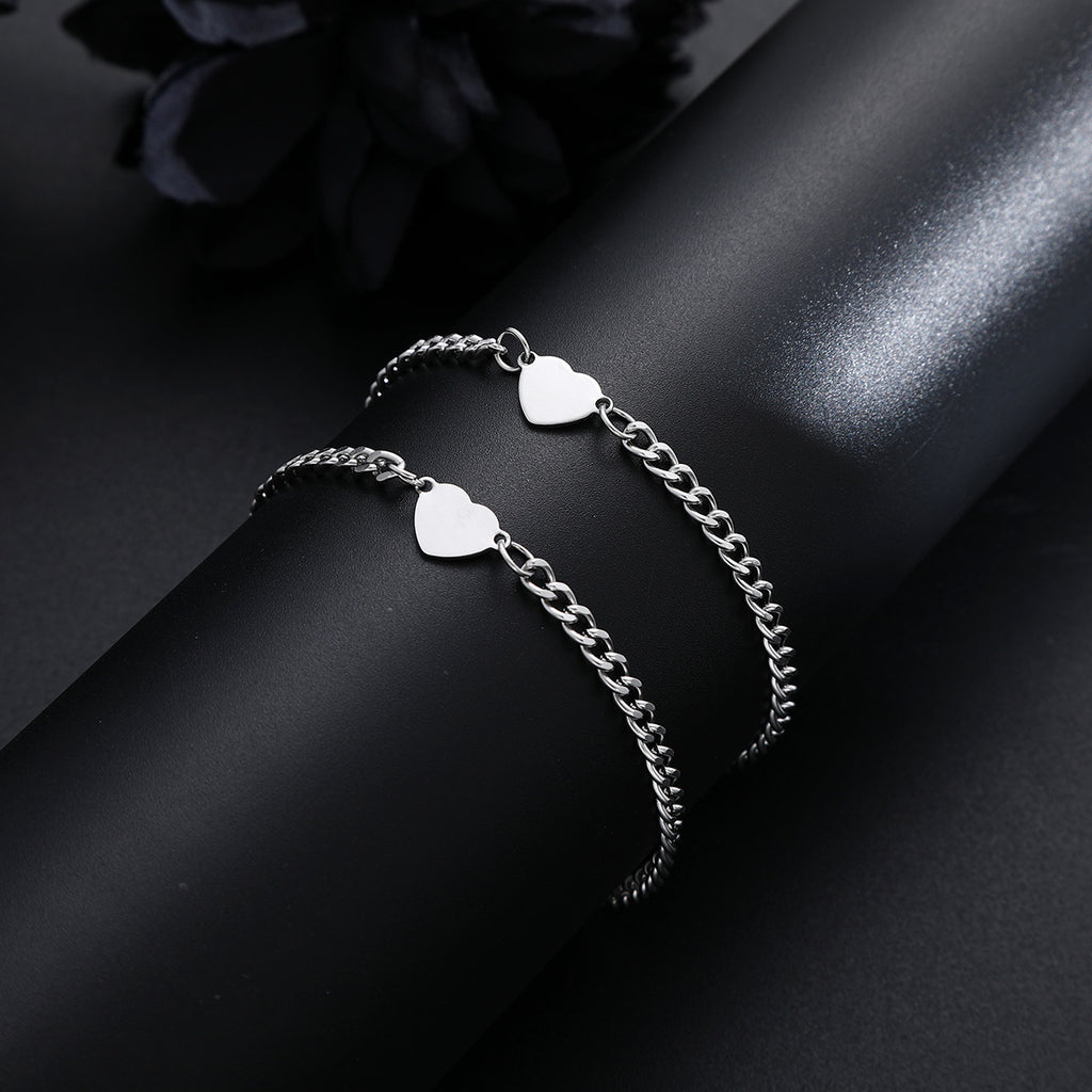 Damenarmband mit herzförmigen Anhängern und eleganter Gliederkette Shop Nory