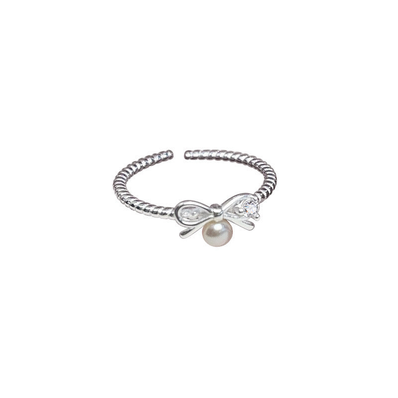 Damen Ring mit verspieltem Schleifendesign und Perlenakzent Shop Nory