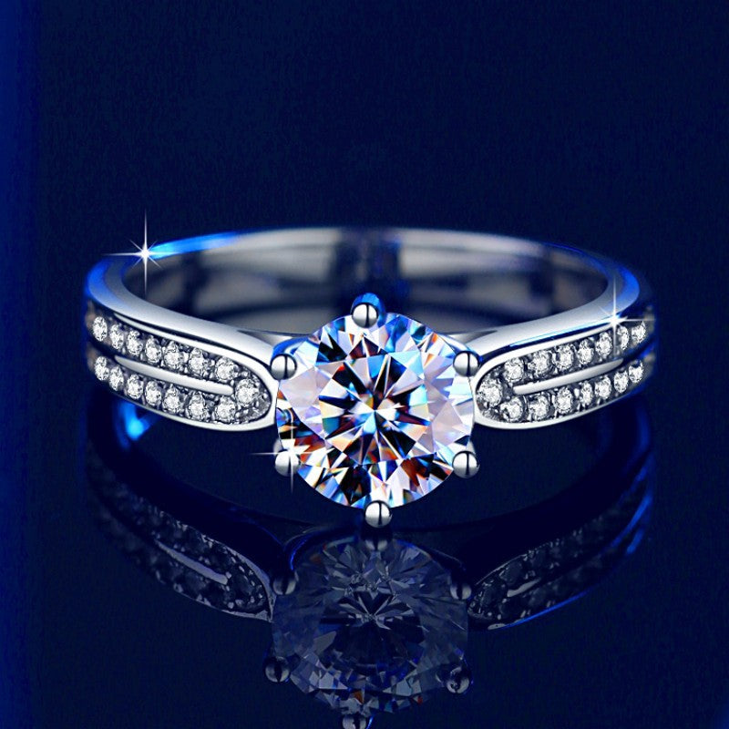 Damen Verlobungsring mit funkelndem runden Zirkonia und eleganter Fassung Shop Nory