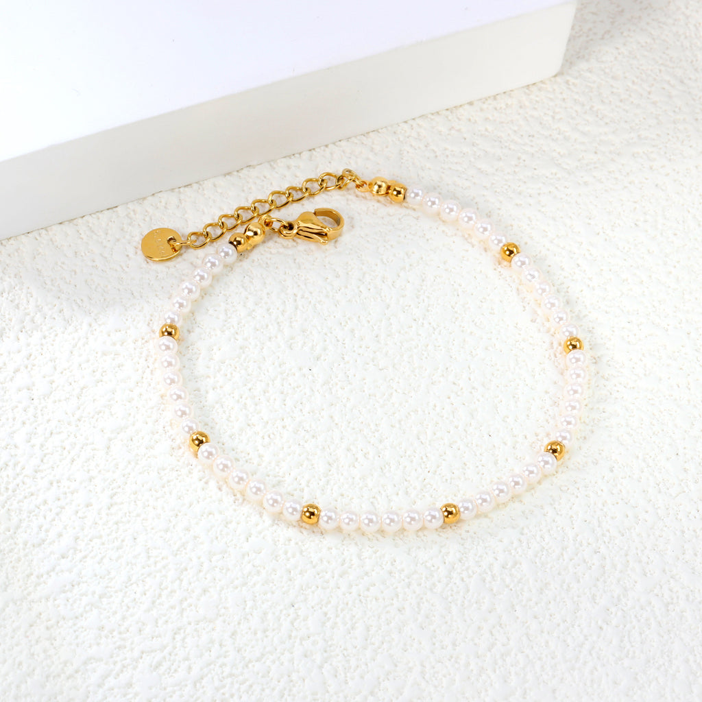 Damen zartes Armband mit Perlen- und goldplattierten Akzenten Shop Nory