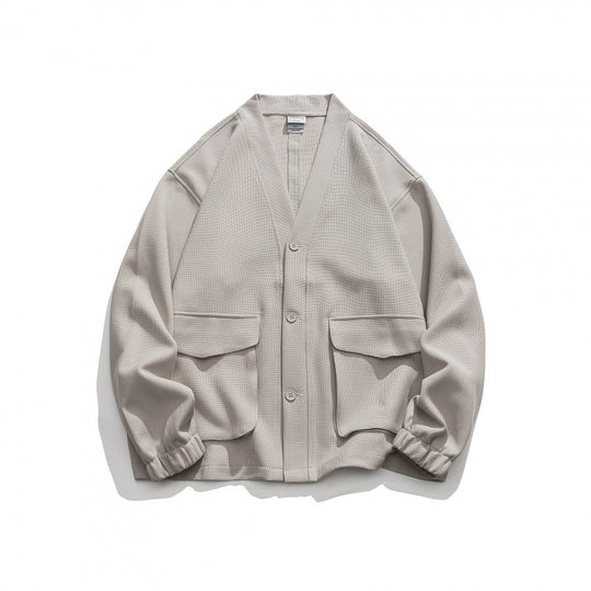Unisex Oversize-Strickjacke mit großen Klappentaschen und Waffelstruktur Shop Nory