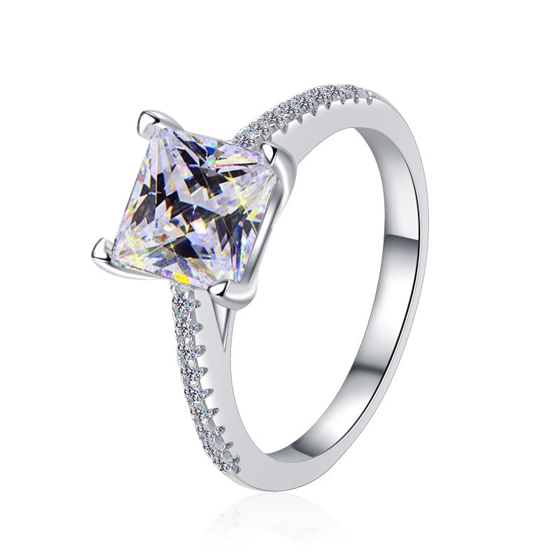 Damen Verlobungsring mit funkelndem quadratischem Zirkonia und filigranem Design Shop Nory