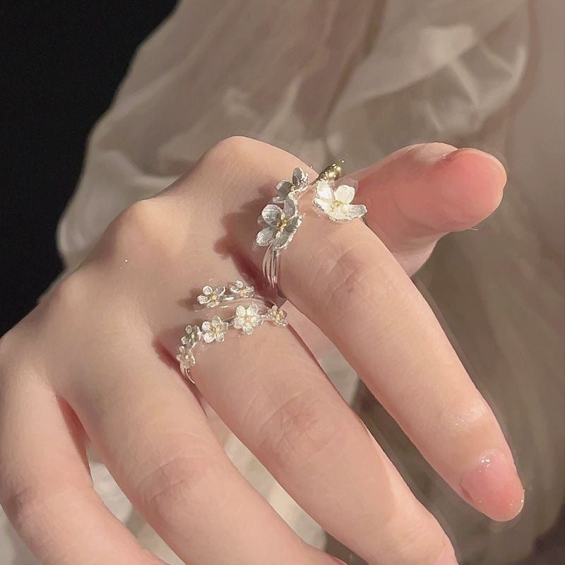 Damen filigraner Blumenring mit funkelnden Zirkonia-Akzenten Shop Nory