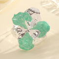 Damen Blütenförmiger Ring aus glänzendem Metall und hochwertigem Epoxidharz Shop Nory