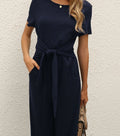 Damen Jumpsuit mit taillierbarem Bindegürtel und praktischen Taschen Shopnory