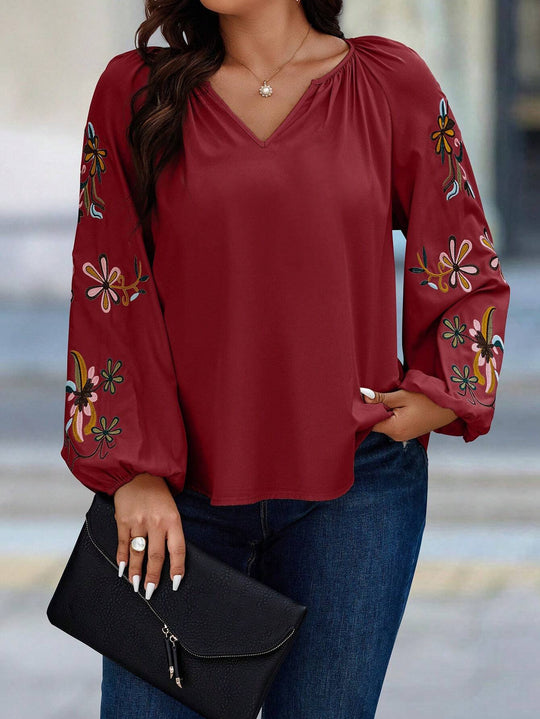 Damen Locker sitzende V-Ausschnitt Bluse mit floraler Stickerei an Ballonärmeln Shop Nory