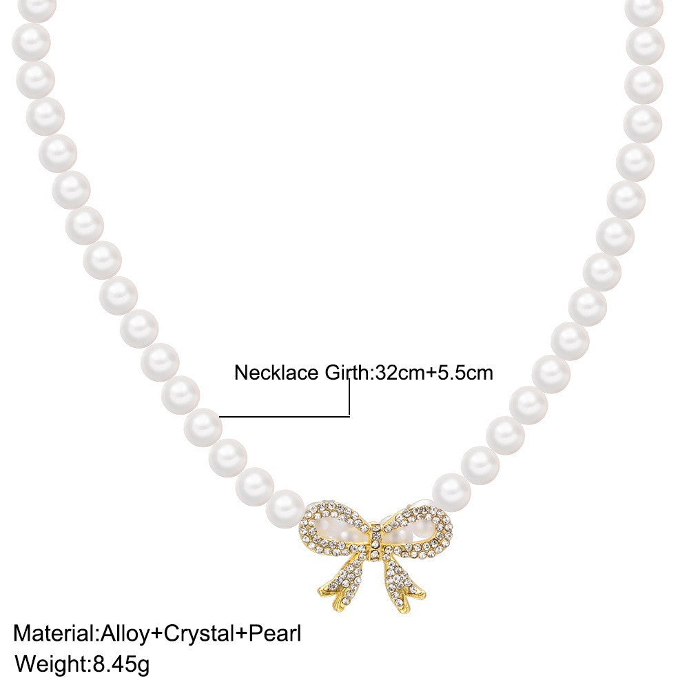 Damen Perlenhalskette mit glamourösem Schleifenanhänger Shop Nory