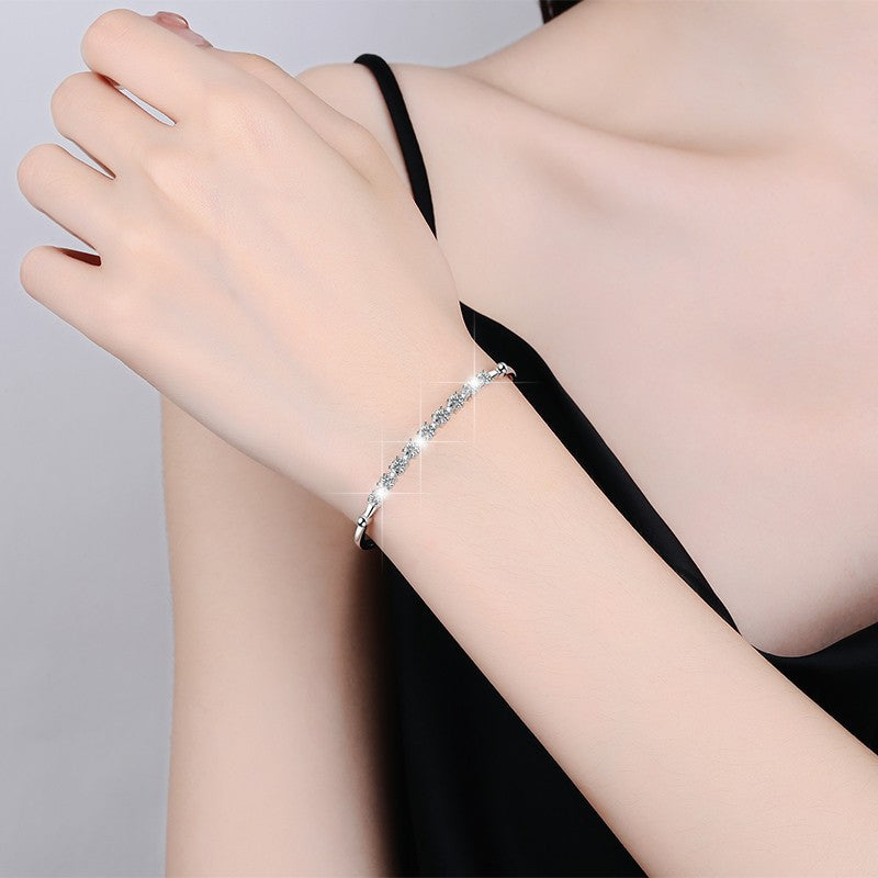 Damenarmband mit funkelnden Zirkonia-Steinen und eleganter Fassung Shop Nory