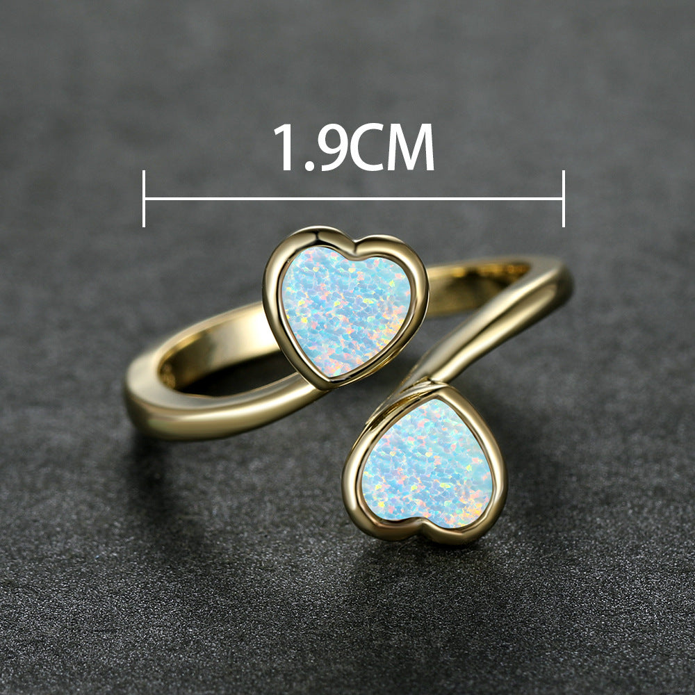 Damen Ring mit strahlendem Herzdesign und leuchtenden Opal-Effekten Shop Nory