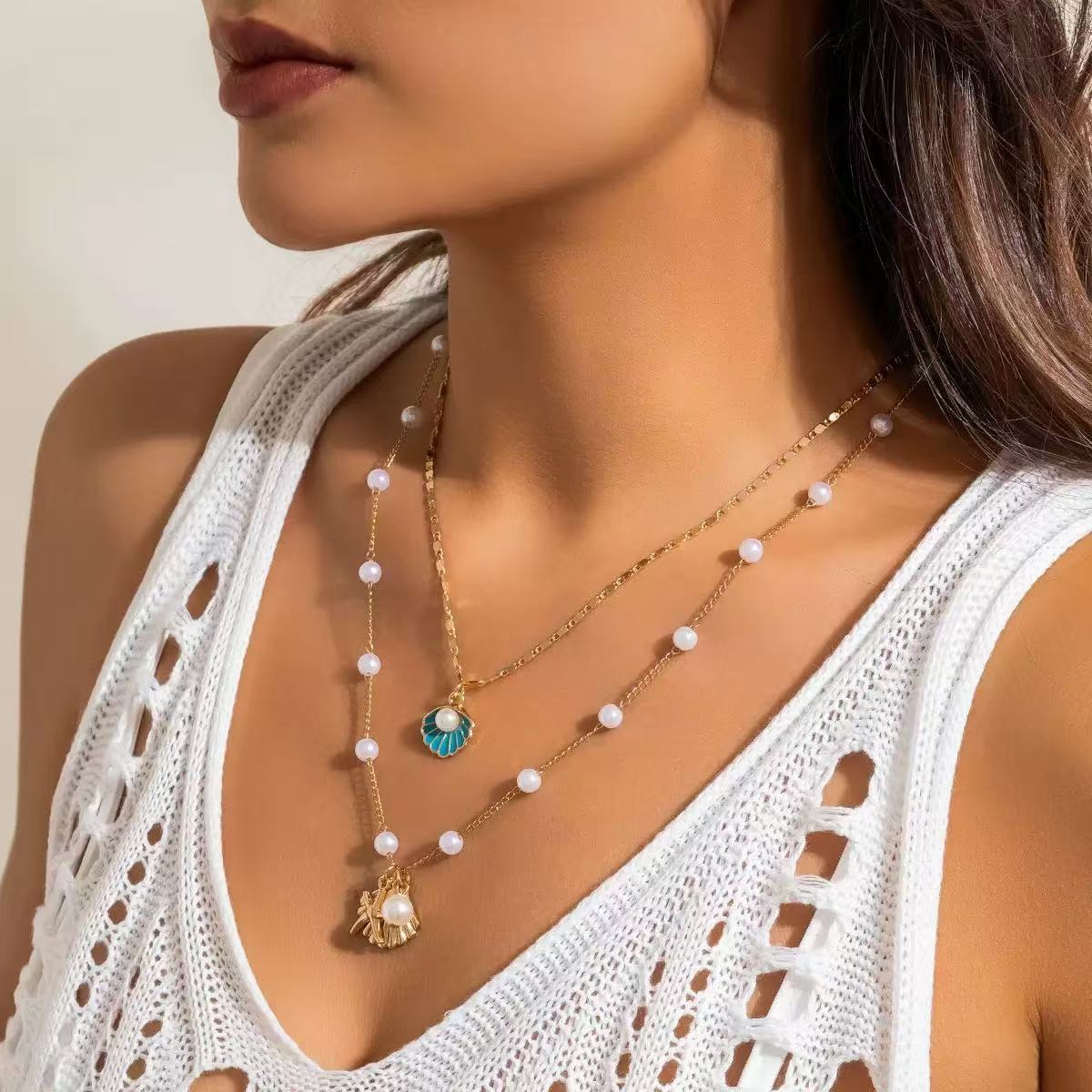 Damen mehrlagige Halskette mit Muschelanhängern und eleganten Perlen-Details Shop Nory