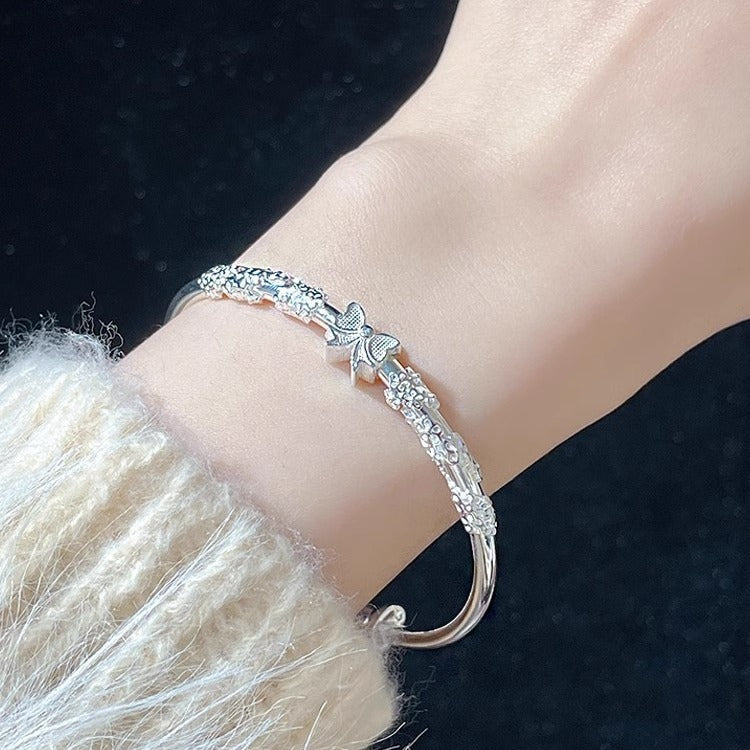 Damen Armband mit floralen und schimmernden Details Shop Nory