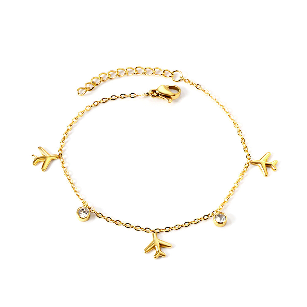 Damen Armband mit einzigartigem Flugzeuganhänger und funkelnden Kristallelementen Shop Nory