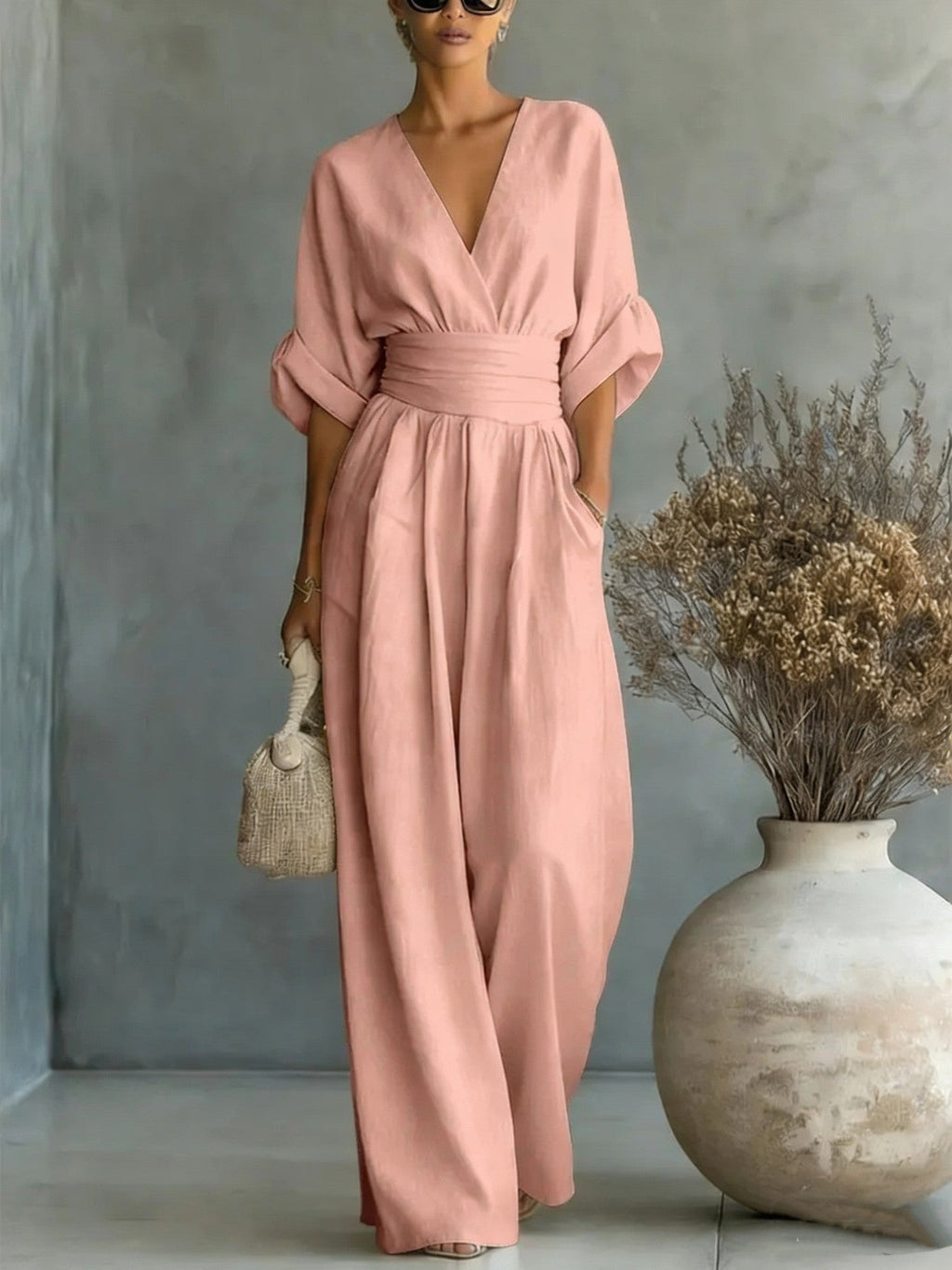 Eleganter Ärmelloser Jumpsuit mit Tiefem V-Ausschnitt, Taillenbund und Weitem Bein