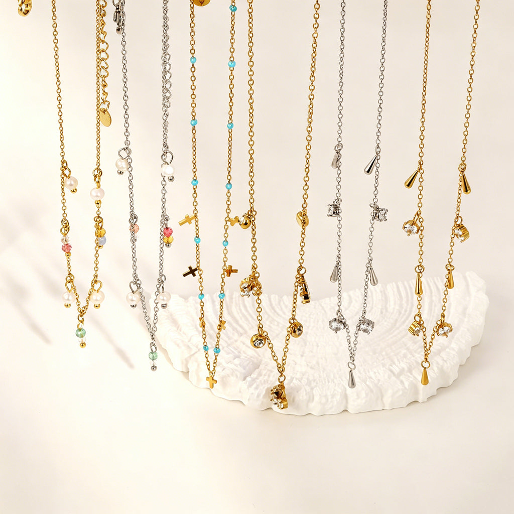 Damen Halskette mit funkelndem Kreuz-Anhänger und eleganten Glasperlen Shop Nory