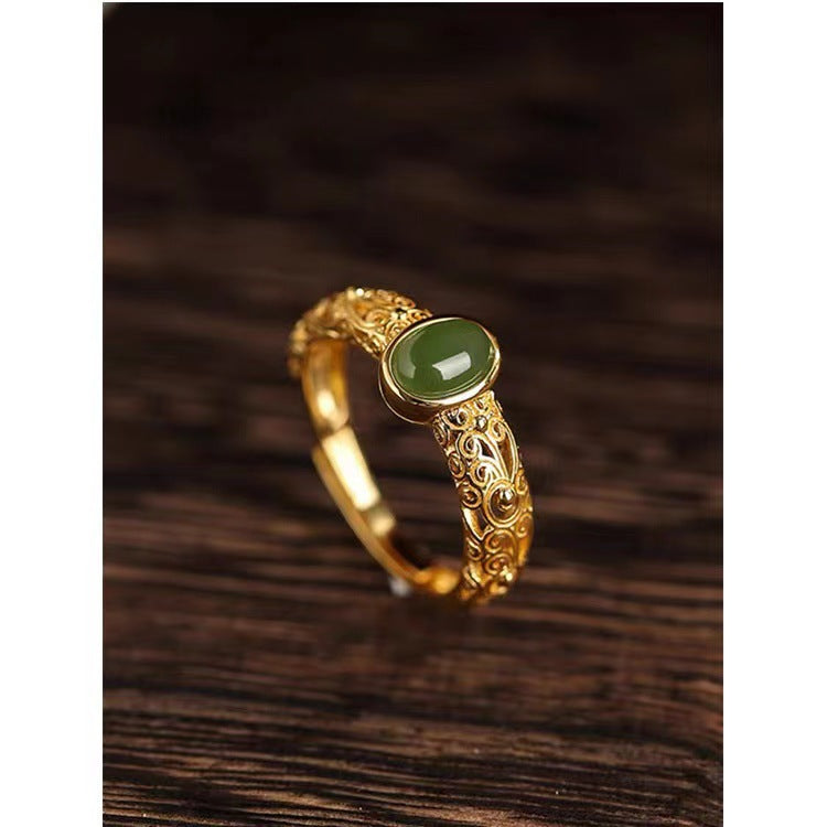 Damenring mit kunstvollem, floralem Design und grünem Edelstein Shop Nory