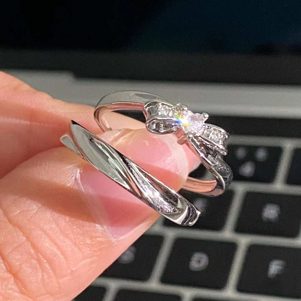 Damenring mit elegantem Schleifenmotiv und funkelnden Akzenten Shop Nory