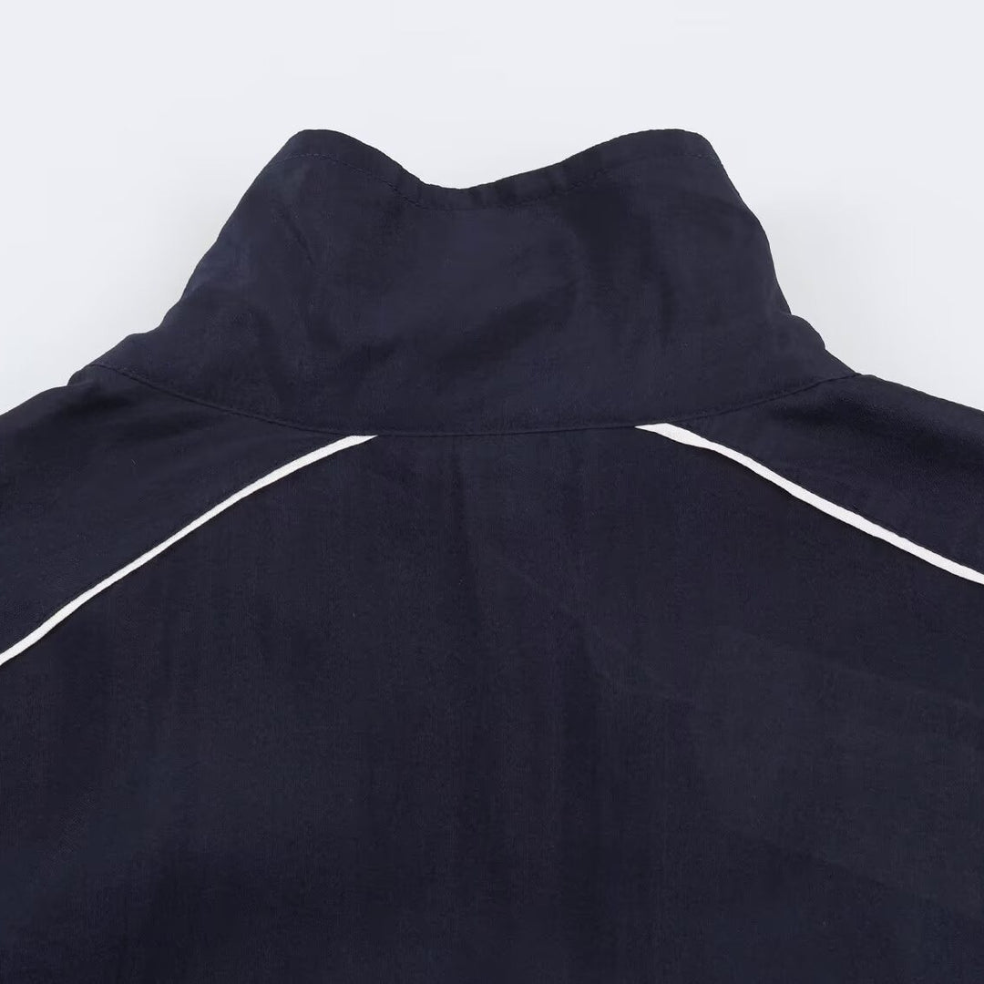 Damen Cropped Windbreaker-Jacke mit hohem Funnelkragen, Kontrastpaspel und elastischem Saum Shop Nory