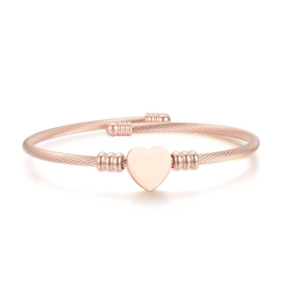 Damen Armreif mit stilvollem Herzanhänger aus hochwertigem Edelstahl Shop Nory