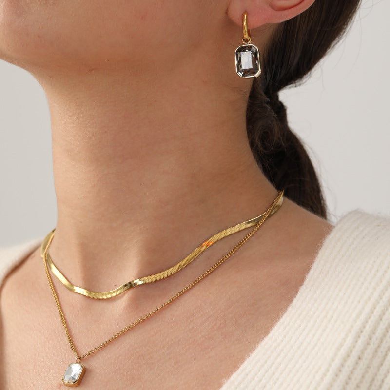 Damen Edelstahl Ohrhänger mit funkelnden Zirkonia und goldplattiertem Design Shop Nory