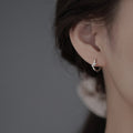 Damen-Ohrstecker mit filigranem Vogel-Design und funkelnden Zirkonia Shop Nory