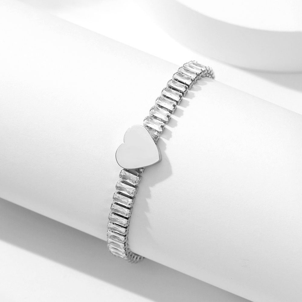 Damen Armband mit funkelndem Zirkonia und herzförmigem Anhänger Shop Nory