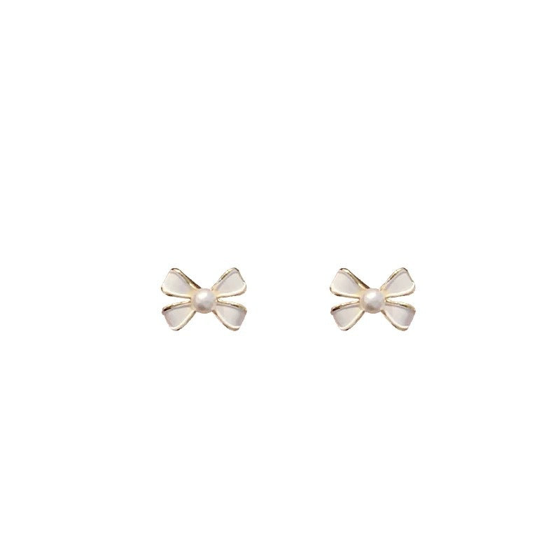 Damen Ohrstecker mit floralen Schleifenmotiven und edlen Perlendetails Shop Nory