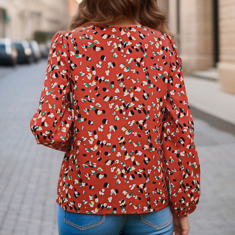 Damen Locker geschnittene V-Ausschnitt-Bluse mit kontrastierter Zierblende und Allover-Print Shop Nory