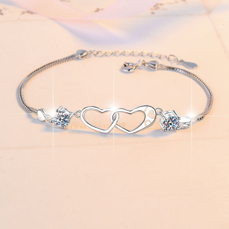 Damenarmband mit Herzdesign und funkelnden Kristallen Shop Nory