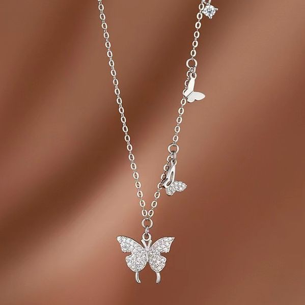 Damen Halskette mit filigranem Schmetterlingsdesign und funkelnden Zirkonia Shop Nory