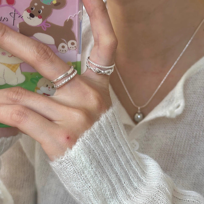 Damen zierlicher Ring mit verspieltem Schleifenmotiv und feinen Zirkonia Akzenten Shop Nory