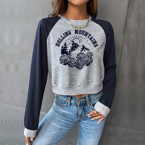 Damen Cropped Raglan-Sweatshirt mit Bergmotiv, Rippbündchen und lockerer Passform Shop Nory