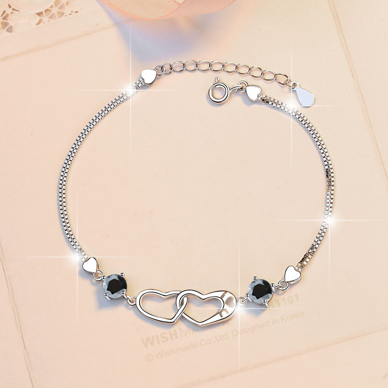 Damenarmband mit elegantem Herzdesign und funkelnden Zirkonia Shop Nory
