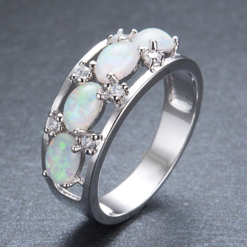 Damen Ring mit leuchtenden Opalsteinen und funkelnden Zirkonia-Elementen Shop Nory