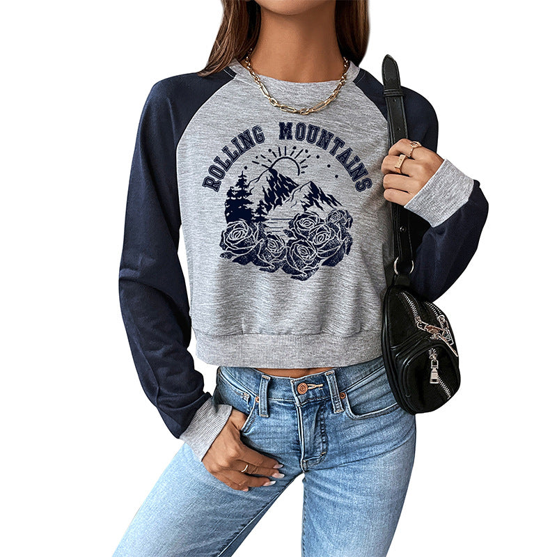 Damen Cropped Raglan-Sweatshirt mit Bergmotiv, Rippbündchen und lockerer Passform Shop Nory