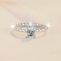 Damenring mit elegantem quadratischem Zirkonia und drehbarem Design Shop Nory