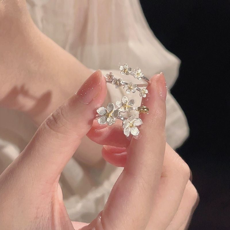 Damen filigraner Blumenring mit funkelnden Zirkonia-Akzenten Shop Nory