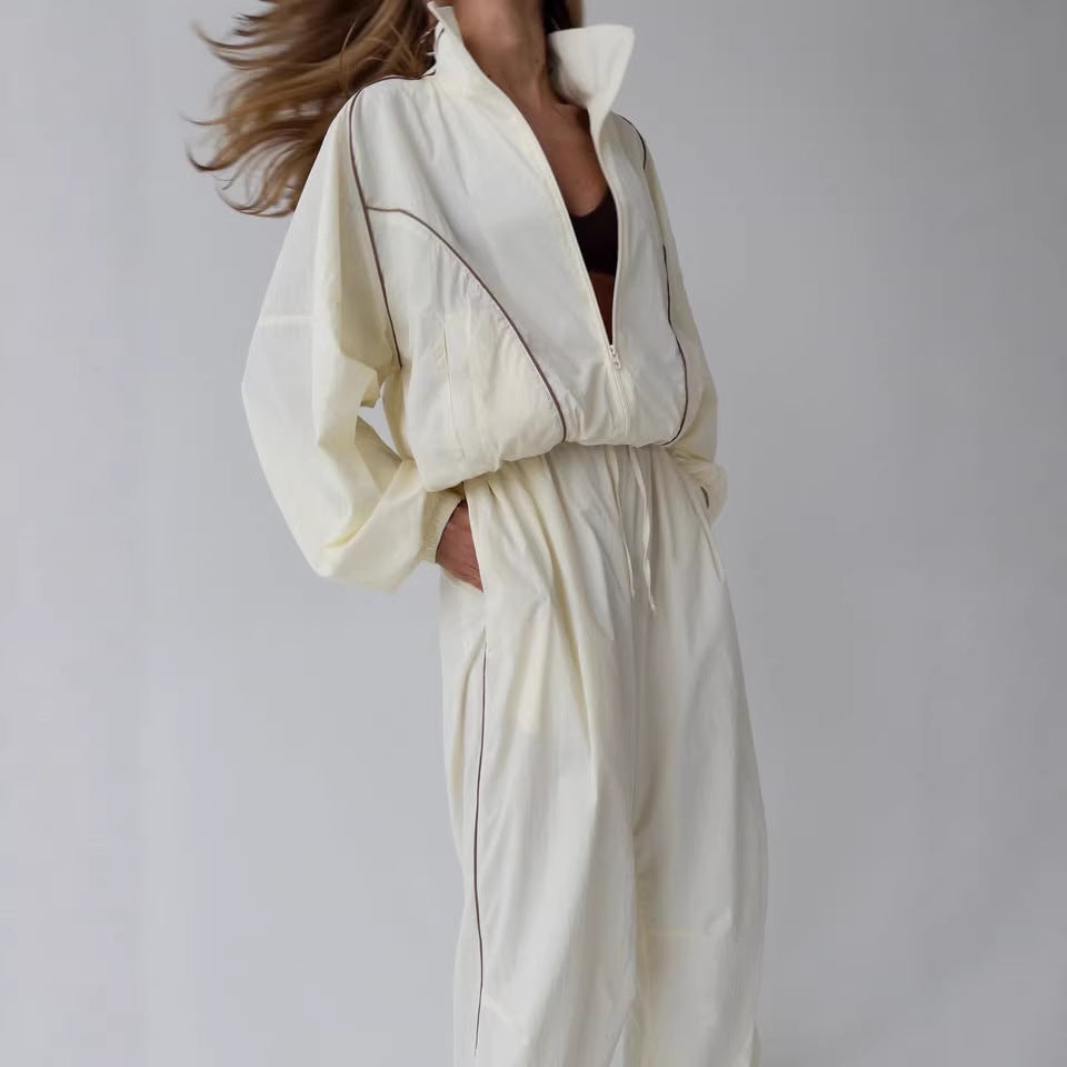 Damen leichter Windbreaker-Zweiteiler mit Stehkragen, durchgehender Reißverschluss, kontrastierender Kedernaht und weiter Palazzo-Hose Shop Nory