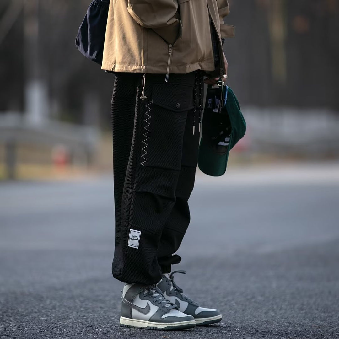 Herren weite Cargo-Jogginghose mit Kordelzug Klapptaschen und elastischen Bündchen Shop Nory