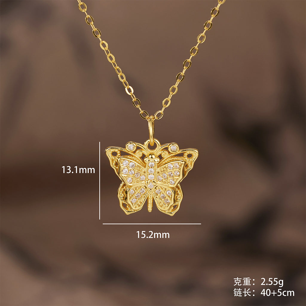 Damen Halskette mit kunstvollem Schmetterlingsanhänger aus goldfarbenem Metall und funkelnden Zirkonia Shop Nory