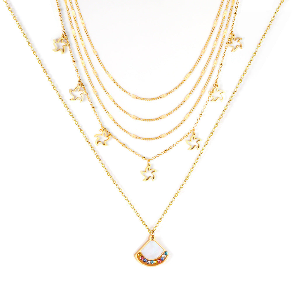 Damen mehrlagige Halskette mit goldplattierten Sternenanhängern und funkelndem Hauptanhänger Shop Nory