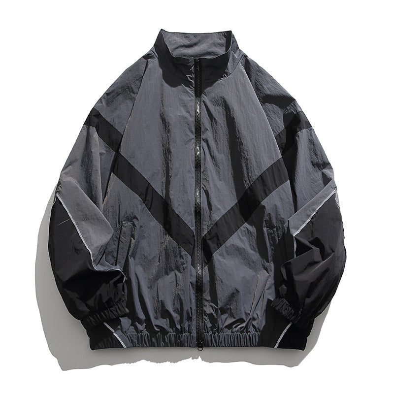 [Unisex] Oversize technische Wind- und Regenjacke mit Stehkragen, reflektierenden Paspeln und elastischem Saum Shop Nory