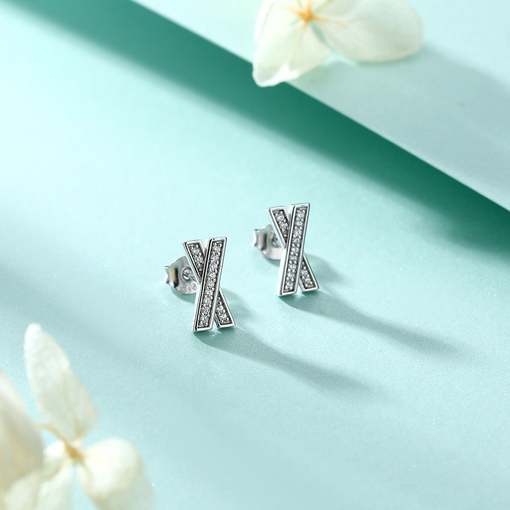 Damen Ohrringe im modernen X-Design mit funkelnden Zirkonia Shop Nory