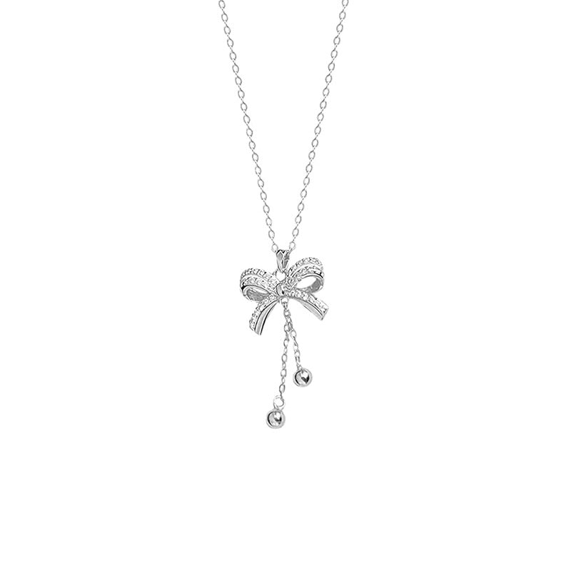 Damen Halskette mit eleganter Schleifenapplikation und funkelnden Details Shop Nory