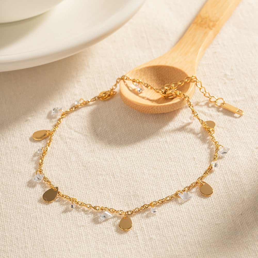 Damen Armband mit funkelnden Kristall- und Tropfenanhängern Shop Nory