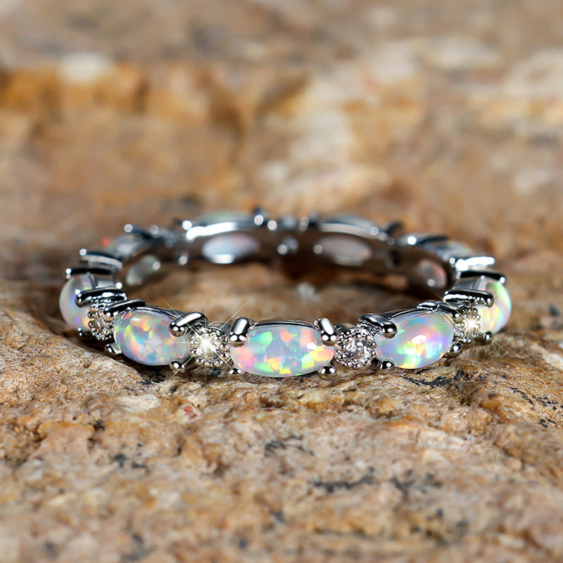 Damen Ring mit funkelnden Opalsteinen und filigranem Design Shop Nory